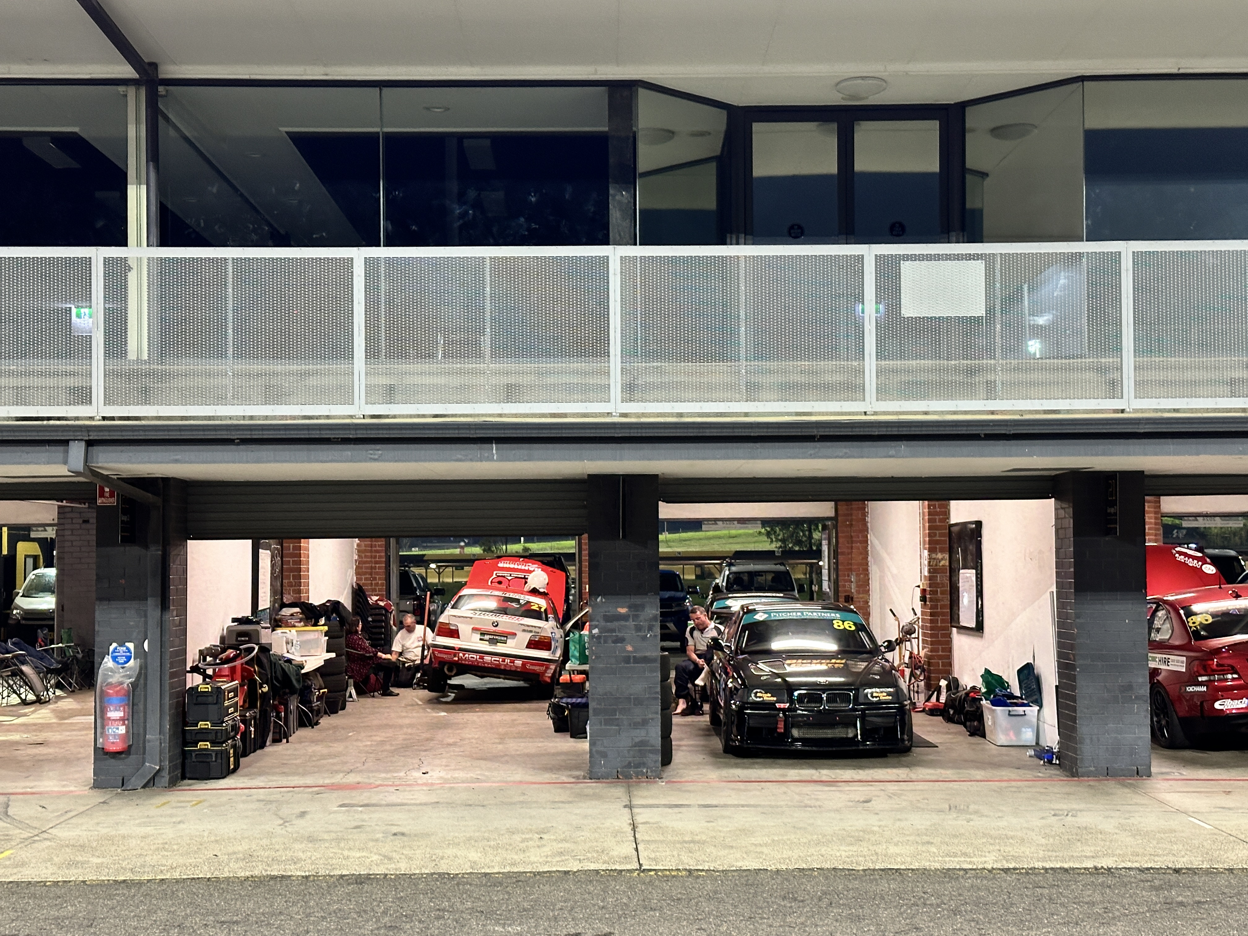 Race cars in the pit garage